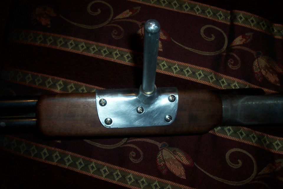 Wooden part with metal bracket and chrome lever