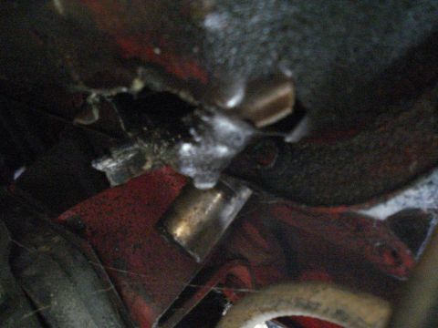 1984 Jeep J-10 - A close-up view of a damaged engine component, with the Supermotors logo visible at the bottom right.