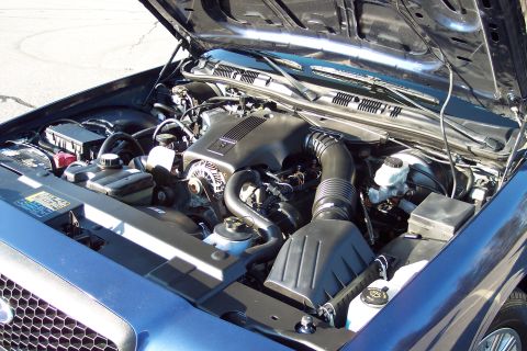 2001 Ford Crown Victoria - Engine bay of a 2001 Ford Crown Victoria, viewed from the front with the hood raised.