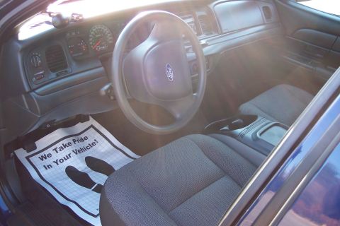 2001 Ford Crown Victoria - Interior view of a 2001 Ford Crown Victoria, the dashboard and seats.