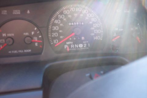 2001 Ford Crown Victoria - The dashboard gauges of a 2001 Ford Crown Victoria display mileage and gear selection.