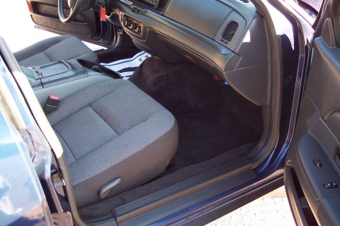 2001 Ford Crown Victoria - Interior view of a 2001 Ford Crown Victoria, highlighting the passenger side and dashboard.