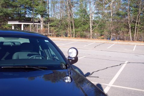 2001 Ford Crown Victoria - Front quarter view of a 2001 Ford Crown Victoria police car, showing the spotlight on the fender.