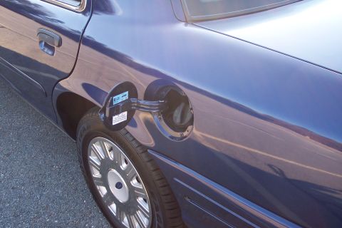 2001 Ford Crown Victoria - Close-up of the fuel door and rear wheel of a 2001 Ford Crown Victoria.