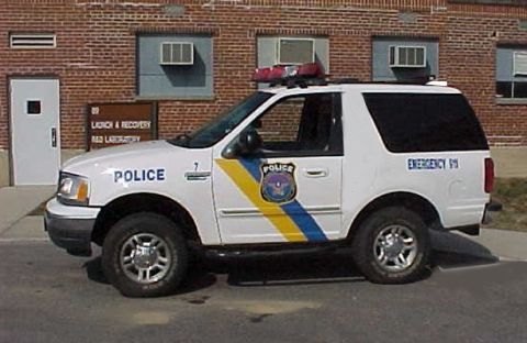 1992 Ford Bronco - This police SUV has 'POLICE' and 'EMERGENCY 911' markings, along with a police department crest.