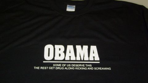 2006 Ford E250 - A black t-shirt displays political text with the name "OBAMA" prominently featured.