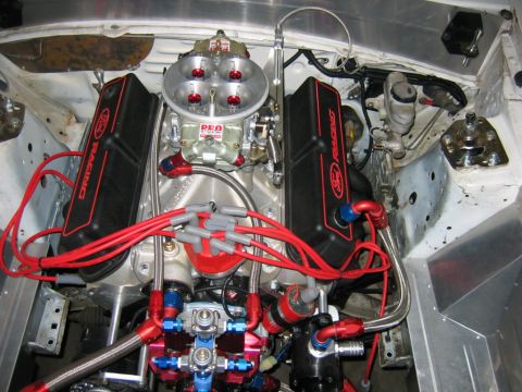 1992 Ford Mustang - Close-up view of a modified engine bay, likely from a 1992 Ford Mustang, performance parts and custom wiring.