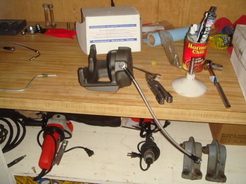 1992 Ford Bronco - Workbench with a brake caliper, tools, and a can of Hormel chili.