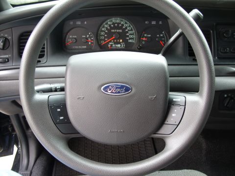 2005 Ford Crown Victoria - I installed Cruise Control by installing a new steering wheel and having the dealer re-program the PCM. Less than $200 total!!!