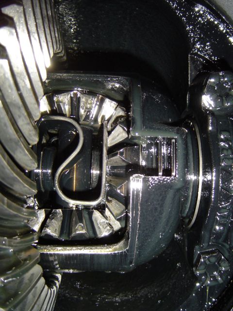 1989 Ford Bronco - Close-up view of differential gears, a U-shaped clip securing internal components.