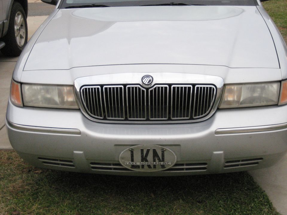 Front grille of a silver Mercury Grand Marquis with waterfall grille