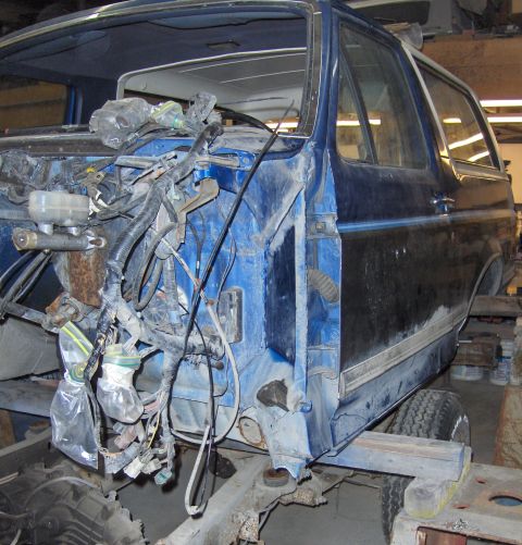 1990 Ford Bronco - This blue Ford Bronco is undergoing a frame-off restoration, with its front end completely dismantled.