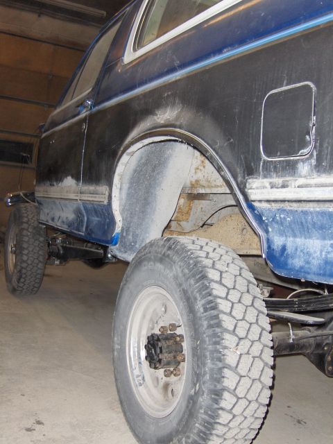 1990 Ford Bronco - This Ford Bronco appears to be in a state of repair, with visible rust and unfinished bodywork.