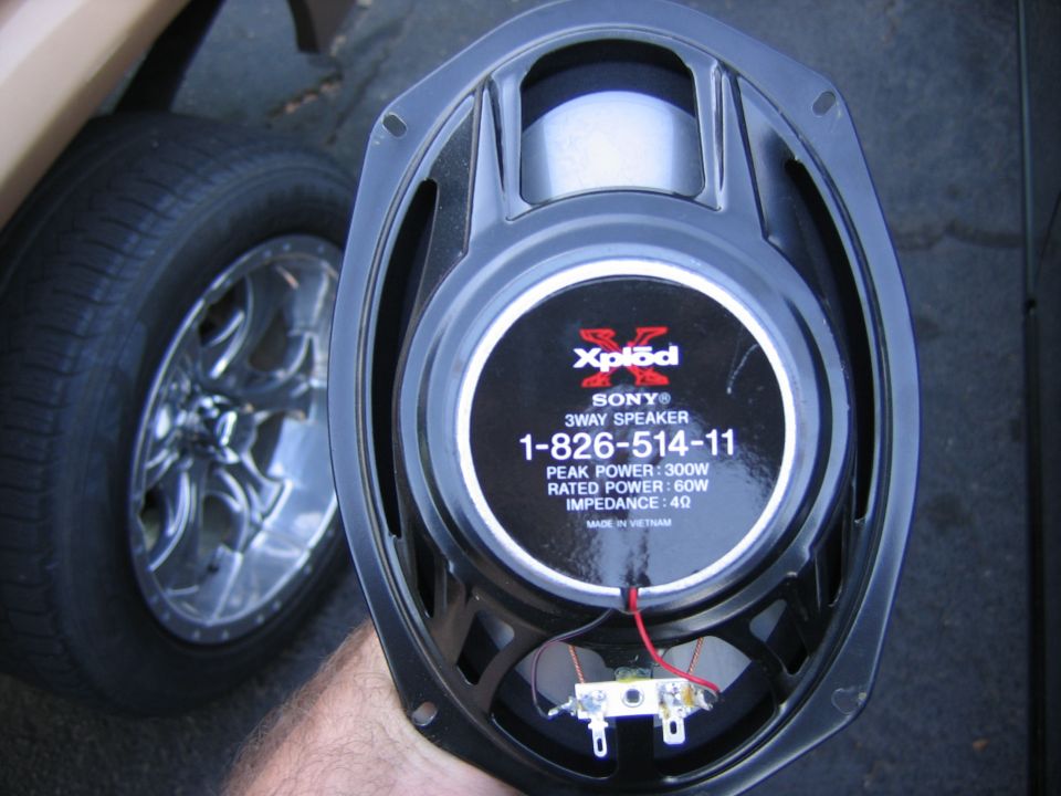 Sony Xplod 3-way speaker with part number 1-826-514-11 next to a car wheel