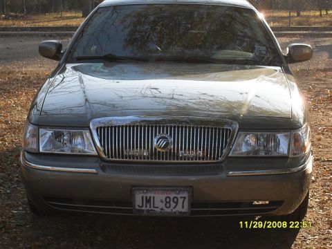 2004 Mercury Marquis - This 2004 Mercury Grand Marquis features a distinctive chrome grille and a front-facing view, captured on November 29, 2008.