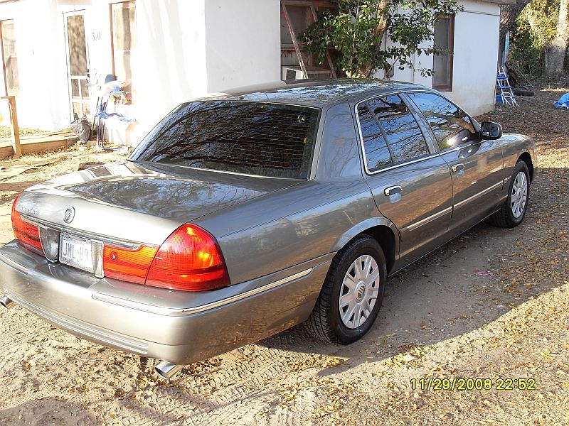 Gray 2004 Mercury Grand Marquis sedan, rear 3/4 view