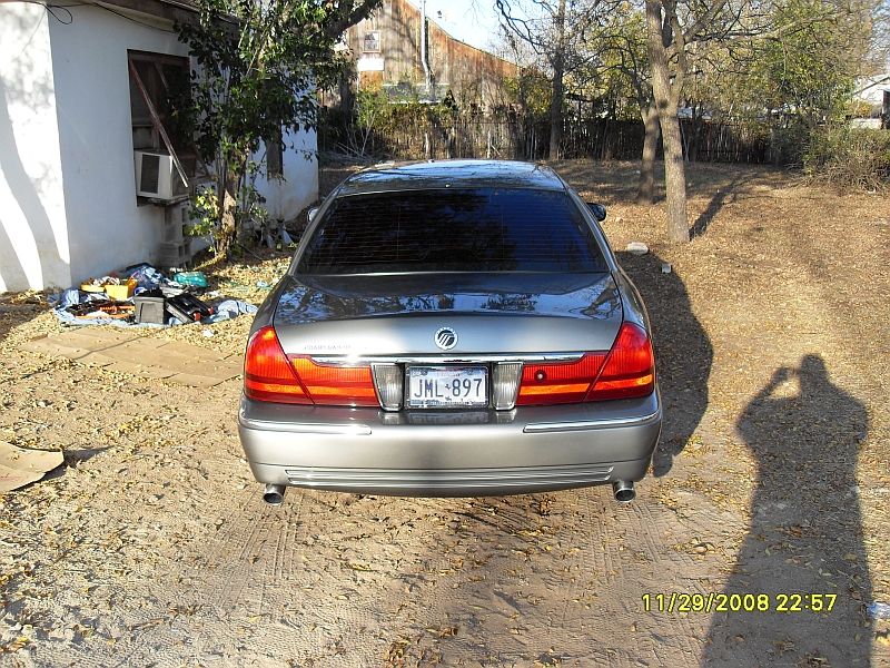 Silver 2004 Mercury Grand Marquis rear view with license plate JML 897