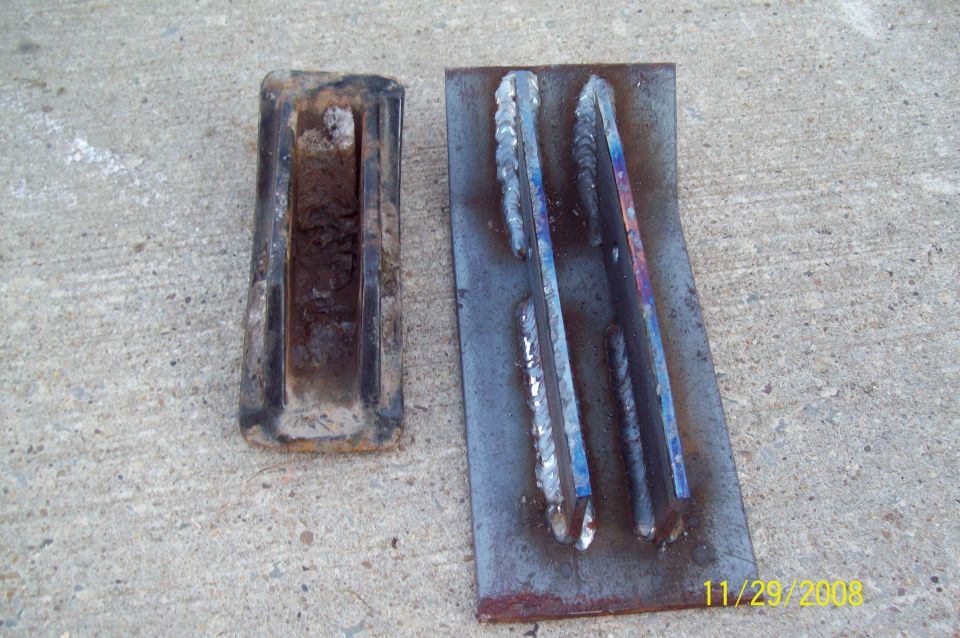 Rusty metal part next to welded metal samples on concrete