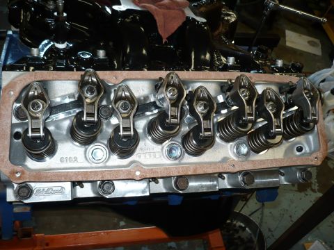 1973 Ford Ranchero - Engine valve train components are visible, including rocker arms and springs, with Edelbrock branding on a part.