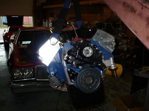 1973 Ford Ranchero - Engine removal in progress for a 1973 Ford Ranchero, with another vehicle visible in the background.
