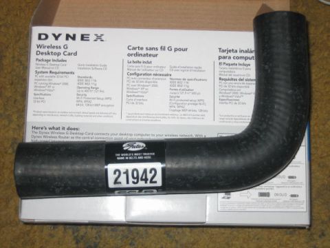 1996 Ford Thunderbird - A black rubber hose with a white label displaying the number 21942 is shown in front of a Dynex Wireless G Desktop Card box.
