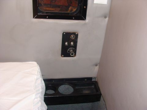 1992 Ford Bronco - Close-up of the interior of a vehicle, showing a control panel and a bed.