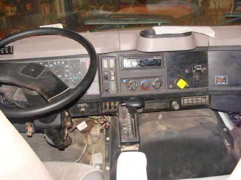 1992 Ford Bronco - Interior view of a truck's dashboard, showing the steering wheel, instrument cluster, and center console.