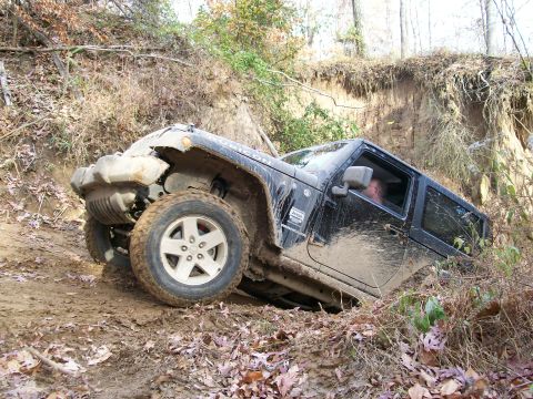 2007 Jeep Wrangler - Jeep Wrangler off-roading and getting stuck in the mud on a steep hill.