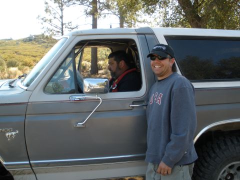 2008 Ford Bronco - A two-tone Ford Bronco is shown with two men, one inside and one outside the vehicle.