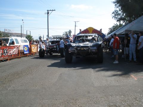 2008 Ford Bronco - This off-road racing truck, possibly a custom build, is seen at an event with Red Bull sponsorship and a prominent roll cage.