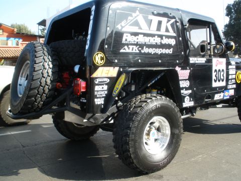 2008 Ford Bronco - This black Jeep Wrangler displays numerous racing decals and sponsors, including ATK-Jeepspeed and Redlands Jeep.