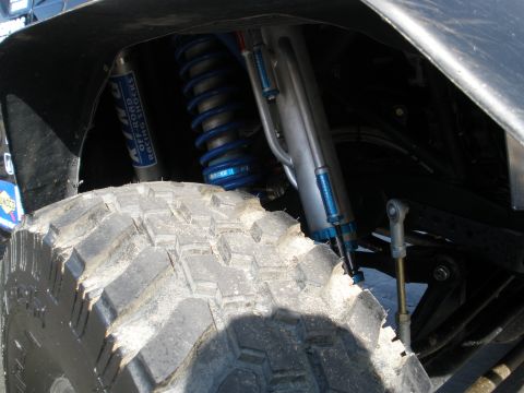 2008 Ford Bronco - King Off-Road Racing Shocks absorber and tire detail from an off-road vehicle.