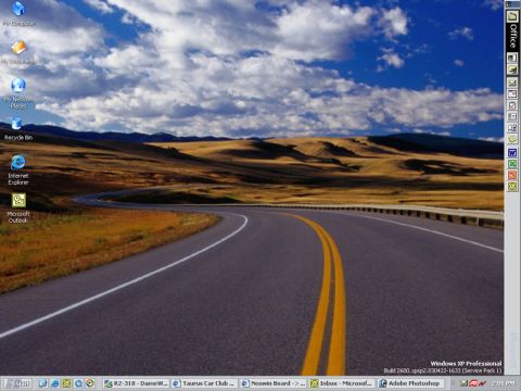 1998 Ford Taurus - Desktop wallpaper displays a scenic view of a road winding through hills, with various Windows icons and a website watermark.