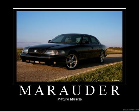 2003 Mercury Marauder - A black 2003 Mercury Marauder is shown from the front-right angle, parked on a roadside.