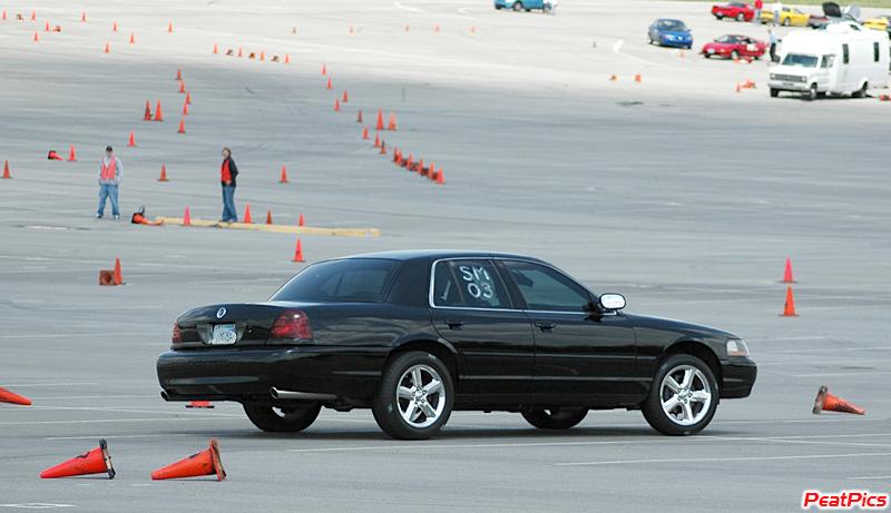 Black 2003 Mercury Marauder on a race track with cones