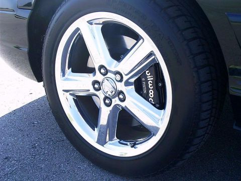 2003 Mercury Marauder - A chrome wheel with a performance brake caliper is shown on a vehicle.