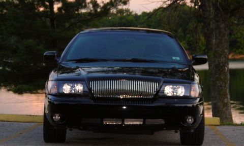 2003 Mercury Marauder - Black 2003 Mercury Marauder parked by a lake at dusk.