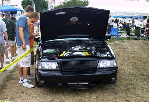 2003 Mercury Marauder - A black car with its hood open, displaying the engine bay. The Supermotors.net logo is visible in the lower right corner.