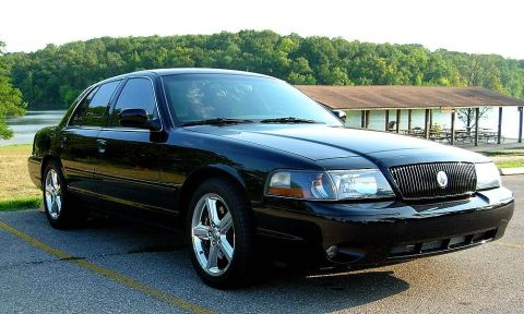 2003 Mercury Marauder - Black 2003 Mercury Marauder parked near a body of water and a picnic shelter.