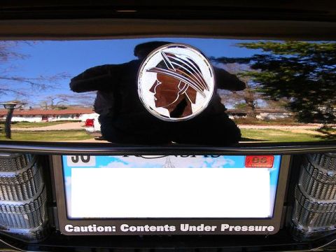 2003 Mercury Marauder - The iconic Mercury emblem is centered on the trunk lid above the license plate frame.