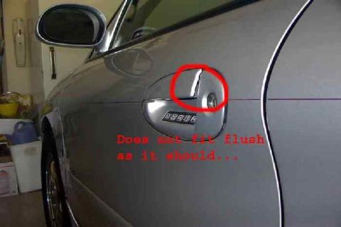 1998 Ford Taurus - The door handle on this silver car does not sit flush as it should, indicating a potential fitment problem.