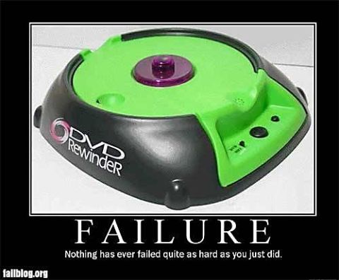 2000 Mercury Grand Marquis - A humorous image of a DVD Rewinder device, labeled as a 'FAILURE'.