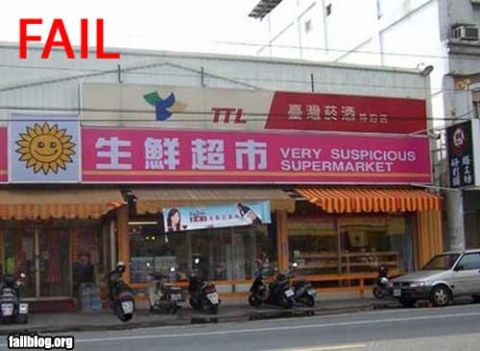 2000 Mercury Grand Marquis - A street scene shows a supermarket with a prominent sign and several parked motorcycles, along with a car.