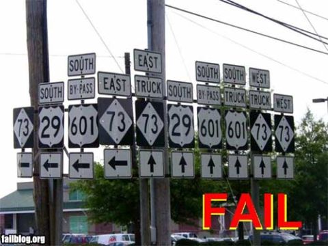 2000 Mercury Grand Marquis - This confusing array of road signs presents multiple route options and directions, making navigation a challenge.