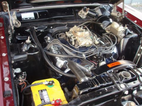 1969 Ford Torino - Close-up view of the engine bay of a 1969 Ford Torino, showing the V8 engine and associated components.