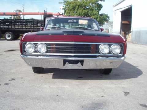 1969 Ford Torino - Front view of a 1969 Ford Torino, a prominent chrome bumper and a distinctive grille.