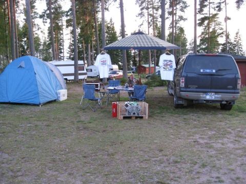 1969 Mercury Cyclone - A campsite setup includes a tent, RVs, a table, and a dark SUV.