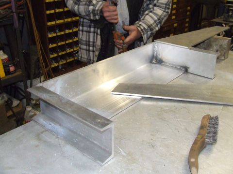 1967 Ford Bronco - Metal components are being fabricated, possibly for a vehicle bumper project, as indicated by the registry label.