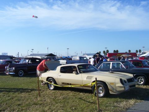 1979 Chevrolet Camaro - A tan 1979 Chevrolet Camaro Z28 is displayed with its hood open at an outdoor car show.
