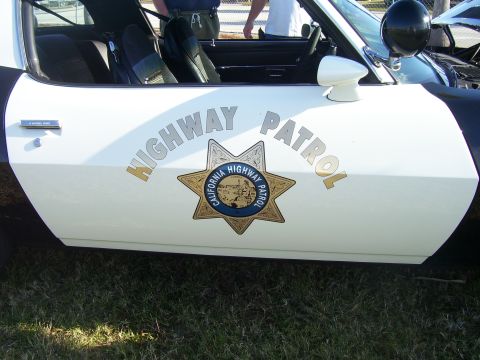 1979 Chevrolet Camaro - This vehicle features the California Highway Patrol insignia on its side, with 'HIGHWAY PATROL' text above the badge.
